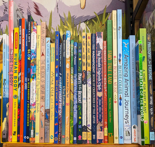 Kidlit books about nature on bookshelf at bookstore